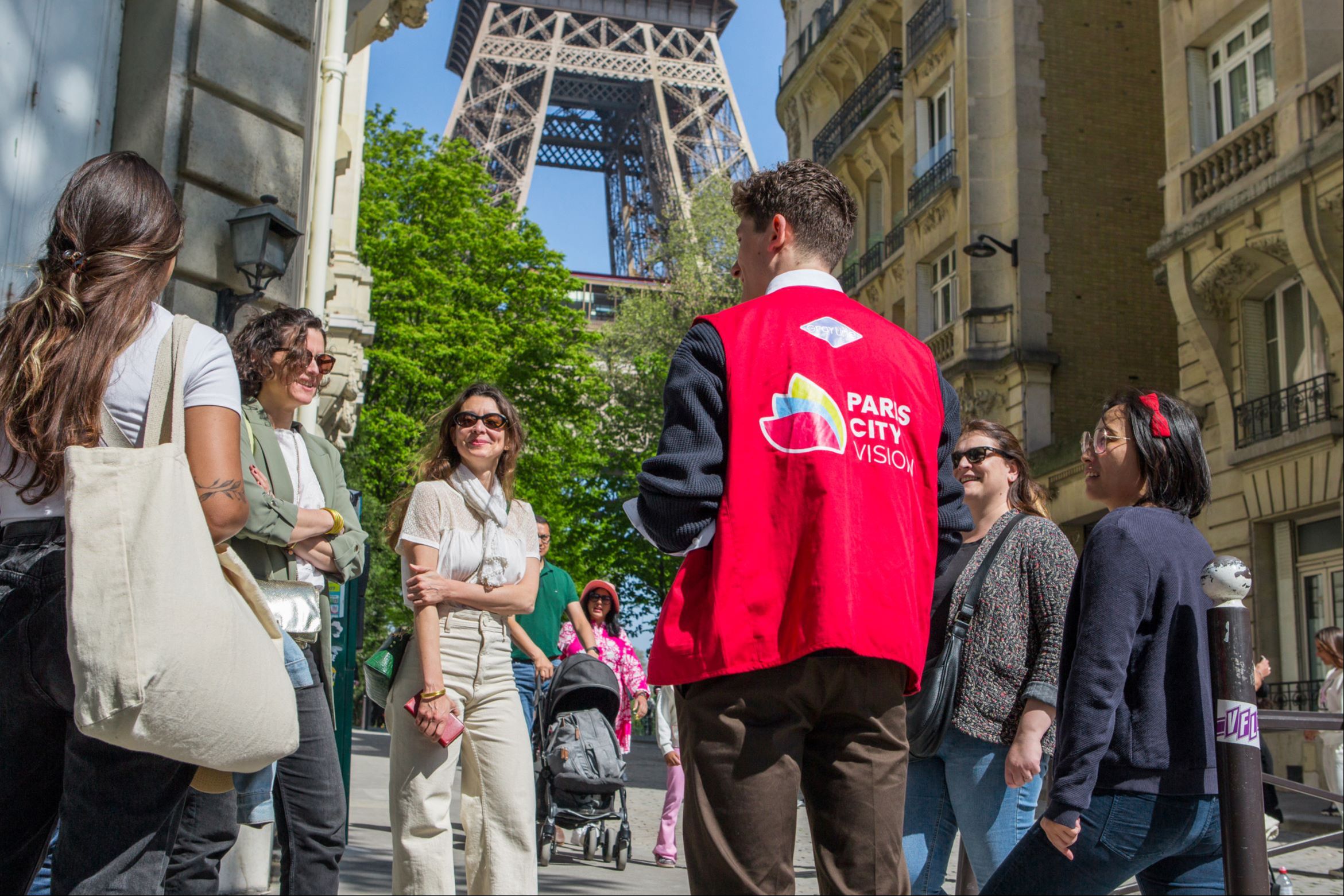 Group of People in front of the Eiffel Tower
